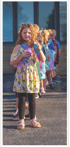 Alena Carlson, age five, daughter of Justin Carlson and Abbie Carlson of Webster lines up for her first day of school at Webster Area Elementary School Aug. 19. Reporter &amp; Farmer | Leyton Beardslee