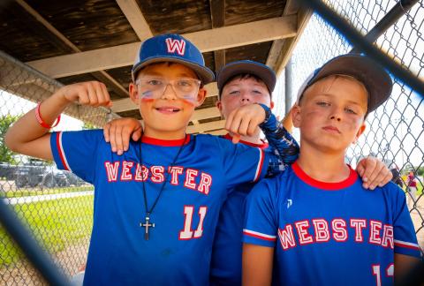 Webster players from left Hunter Swenson, Teagan Schmidt and Cooper Steiner pose in the dugout during the South Dakota U10 State B Tournament in Webster July 19. Webster finished pool play with a record of 2-3 and won their final game to place seventh in the tournament. See more from the tournament on 6. Reporter &amp; Farmer | Leyton Beardslee