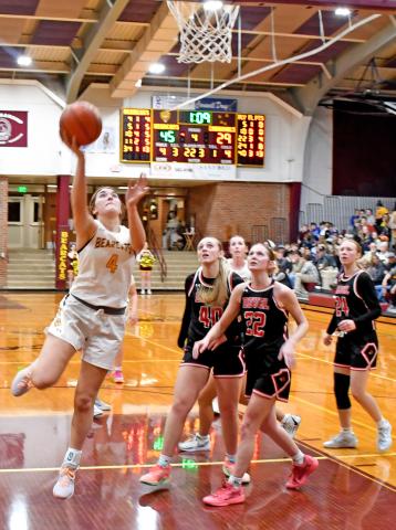 Bearcat number four Mallory Steiner goes up for a basket Jan. 9 in a double header home game against the Deuel Cardinals. The Cats defeated the Cards 47-29. Reporter &amp; Farmer | Robert Dulitz