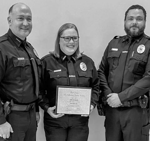 Bobbi Ann Mitchell, pictured center, celebrated the completion of law enforcement school May 2 from Bismarck, ND. She is pictured with Chief Troy White Owl and Sargent Demetrius Jamerson. Mitchell is set to begin working for the city of New Town, ND after completing the 12-week course to become a certified law enforcement officer. She is the daughter of Patti Mitchell of Grenville Reporter &amp; Farmer | Subscriber snapshot