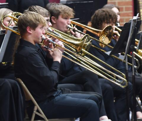 Webster Area Middle School and High School students performed in the winter conert Dec. 5 at the Webster Armory. Here, high school band members in line Michael Dorsett, Lukas Johnson, Thomas Kuecker and Mason Huwe play the trombone as a part of the concert. Reporter &amp; Farmer | Brenner Cariveau