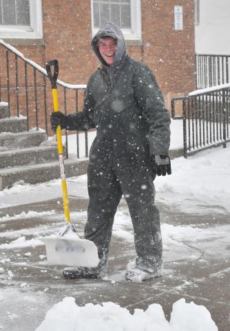Mathew Barrett of Webster shovels snow outside Webster Post Office Nov. 25. Reporter &amp; Farmer | Leyton Beardslee