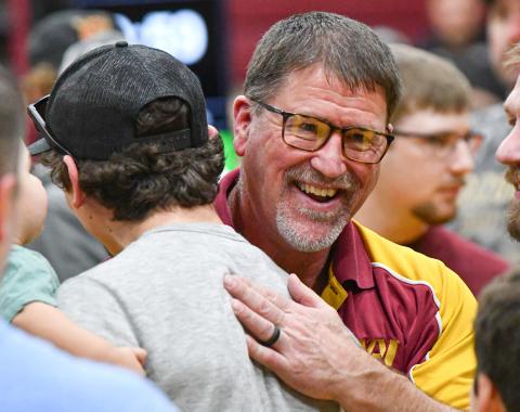 Webster Area head wrestling coach Wade Rausch is congratulated by former wrestlers after being selected as Region 1 coach of the year at SDHSAA Region 1B wrestling tournament in Webster Feb. 21. Rausch has announced his retirement at the end of the school year with his final wrestling meet being the SDHSAA State Wrestling Championship in Sioux Falls Feb. 26-28. Reporter &amp; Farmer | Leyton Beardslee