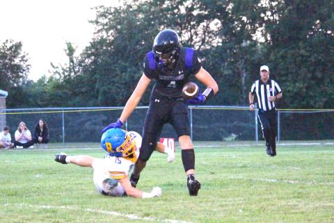 Waubay-Summit tight end Hogan Hlavacek narrowly escapes a Redfield defender Sept. 4. Mustangs defeated the pheasants by a comfortable 50-0 margin, securing its third win of the season and first place in the Eastern Coteau 9-man division. Reporter &amp; Farmer | Timothy Gibson