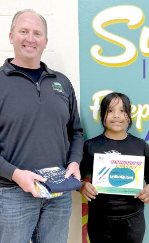 Webster Area School student Lydia Williams, right, was chosen water bottle label design contest winner by Lake Region Electric (LRE). This was the first year that LRE did a water bottle label contest. In the past, they have donated bottled water to the school to use at events and fundraising opportunities. This year they involved third grade students to help educate about electrical safety. Reporter &amp; Farmer | Subscriber snapshot