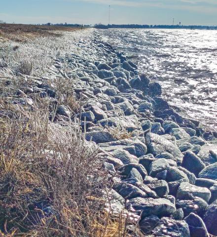 Strong south winds churn the waters along the south side of the U.S. Hwy. 12 Rush Lake grade west of Waubay March 28, sending waves crashing into the rocky shoreline and coating nearby riprap and grass in a layer of ice. Reporter &amp; Farmer | Jessica Washenberger
