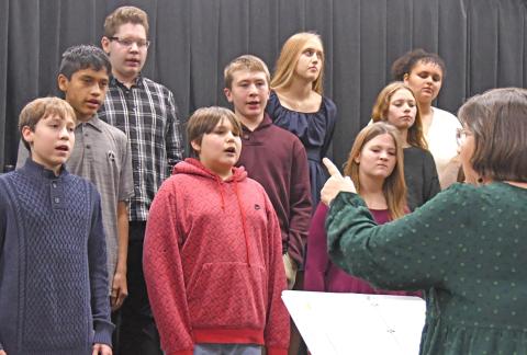 Members of the Waubay Middle School chorus performed Dec. 9 for their Christmas concert. Pictured from left in back are, Tyson Utne, Elise Aker and Kaliesha Neilan; middle row, Victor Vermillion, Conner Butler and Riley Pies; in front are Kellin Boik, Ayden Eagle and Rynsey Jorgenson. The performers were directed by Jill Beers, pictured at bottom right. Reporter &amp; Farmer | Amanda Dulitz