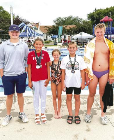 Webster swimmers qualified to swim in the State A swim meet July 18-20. From left are coach Thomas Kuecker, 400 freestyle State A champion Keisha Rencountre, Libby Huggett, Landen Lee and McKoy Pereboom. Reporter &amp; Farmer | Subscriber snaphot