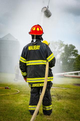 Alex Jorgenson of Waubay Fire Department helps hold the hose for his team during the fire department water fight at Waubay Fun Fest July 19. Waubay was victorious in each of their matches and won the competition. Reporter & Farmer | Leyton Beardslee