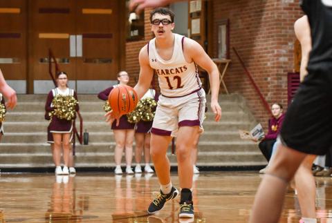 Jeron McCreary (12) of Webster Area looks for an opening during the Bearcats 73-53 win over Waverly-South Shore Coyotes Jan. 27 in Webster. McCreary aided in the victory with a nine point performance. Reporter &amp; Farmer | Leyton Beardslee