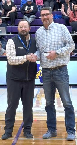 Webster Area third grade teacher and former basketball coach Jared Vergeldt, right, receives his 25 year coaching award from SDHSAA executive director Dan Swartos during halftime of a State A girls basketball tournament game in Watertown March 13. Vergeldt began coaching for the Bearcats in 1997 and spent time coaching boys and girls basketball, track, cross country and volleyball. Reporter &amp; Farmer | Subscriber snapshot