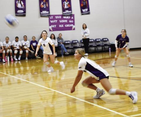 Waubay-Summit Mustangs closed out their regular season as they hosted Webster Area Bearcats Oct. 29. The Mustangs fell in three sets to the Bearcats. Here, Kayce Berger (14) dives for the ball while her teammates JoZee Snyder (16) and Brianna Lindholm (2) watch closely preparing to make a play on the ball. Reporter &amp; Farmer | Brenner Cariveau