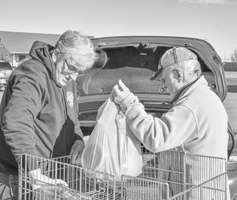Watertown VVA Chapter 1054 president Jerry Denman, left, helps veteran Bob Dolney of Bristol load up groceries at Mike’s Jack &amp; Jill in Webster Nov. 24 during the VVA’s veteran holiday meal give-away. The VVA will be organizing a second holiday meal give-away for Day County Veterans at the same location from 10 a.m. to 2 p.m. Dec. 22. Reporter &amp; Farmer | Leyton Beardslee
