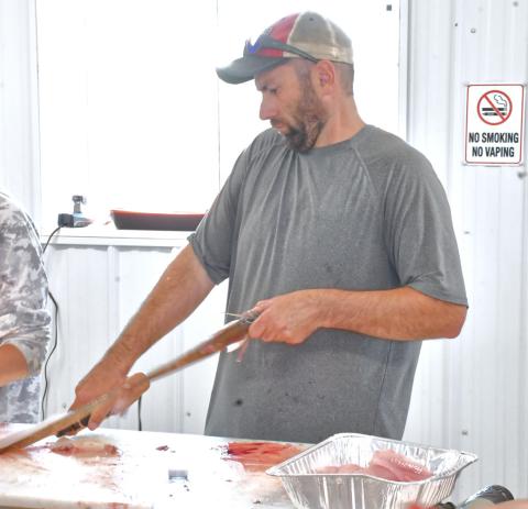 The Master Walleye Circuit was held in Webster at Bitter Lake Aug. 21-22. According to Webster Area Chamber of Commerce president Kelsey Kading, “It took a lot of work and a lot of people, but it was a great turnout and a good weekend for everyone.” Here, Greg McMartin is helping other community members clean fish for the fish fry that was held after the tournament. Reporter &amp; Farmer | Connor Handrahan