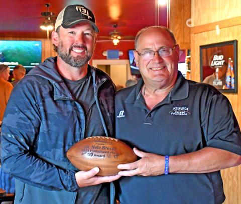 Nathan Breske was presented the Hometown Heros Award from the South Dakota Football Coaches Association July 7 by association representative Bill Weber. Here, Breske is shown with Weber at the Longbranch Bar in Grenville where the award presentation took place in front of family and friends. Reporter &amp; Farmer | Amanda Duitz