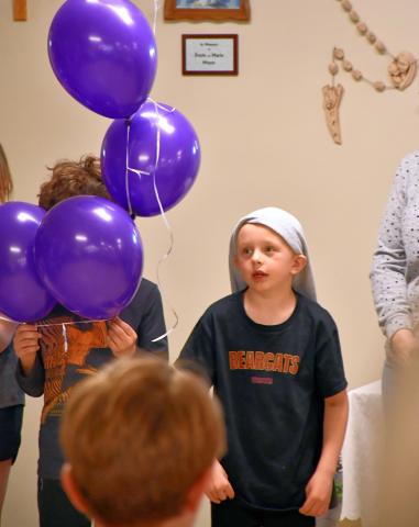 Kohenn Konradi recites the Rosary as part of a balloon Rosary ceremony at Christ the King Parish Center in Webster April 30. Reporter &amp; Farmer | Leyton Beardslee
