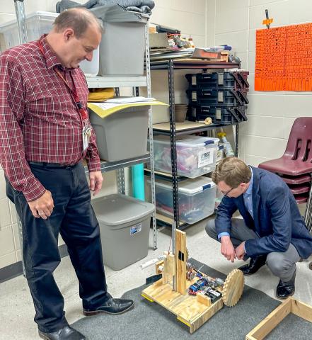 Reporter &amp; Farmer | Subscriber snapshot United States Representative Dusty Johnson (R-SD) visited Webster Area High School last week to speak to students and view the new facility expansion for the CTE wing. Here, Superintendent Jim Block shows the robot-inthe-works by the Webster Area Robotics team as Johnson gets a closer inspection.