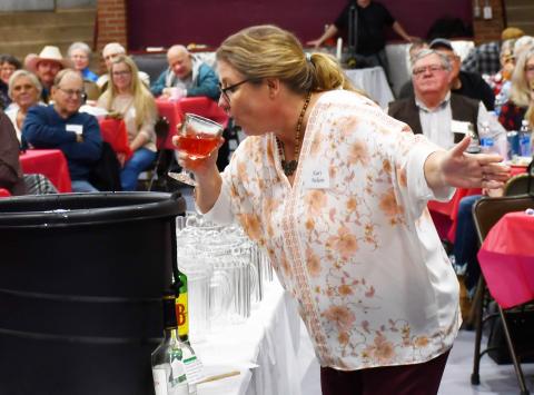 The third annual Day County Veterans Banquet was held at the Webster Armory Nov. 9. One of the events of the night was the annual grog bowl ceremony which sees a variety of unorthodx ingredients added to make a punch. Here, Kari Nelson attempts to drink the first batch of the grog bowl. Reporter &amp; Farmer | Brenner Cariveau