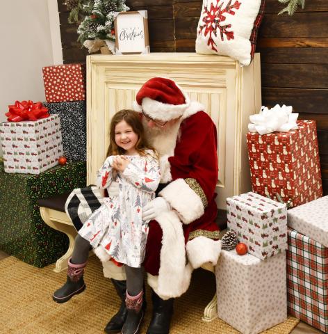 Santa visited the Brewhouse Dec. 21 as part of a fundraising event in a competition with the Grinch. Here, five-year-old Alena Carlson from Webster smiles as Santa asks for her Christmas wishes. Alena asked Santa for Barbie dolls. Alena is the daughter of Abbie Carlson and Justin Carlson. Reporter &amp; Farmer | Brenner Cariveau