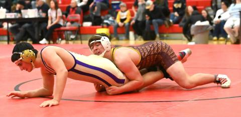 Nathan Hubsch of Webster Area Bearcats attempts to pin his opponent during their match in the Battler Wrestling Invitational Jan. 17 in Gettysburg. Hubsch placed fifth with a record of 4-2 and scored 17 team points. Reporter &amp; Farmer | Brianna Jorgenson, Captured Creations Photography