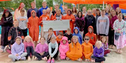 Swimmers accept donation