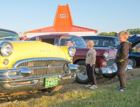 A&amp;W celebration attendees, from left, Grady Tvinnereim, age six, son of Missy Rumpza and Derek Tvinnereim from Webster, and Hayes Spiering, age six, son of Chris and Sarah Spiering of Webster, look at a 1955 Buick during a car show celebrating the A&amp;W restaurant in Webster Sept. 3. Plans were announced earlier this year for the building to be replaced with an updated A&amp;W restaurant. Reporter &amp; Farmer | Leyton Beardslee
