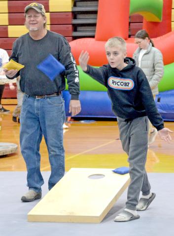 Participating in the Shake Your Shamrock cornhole tournament March 15 at the Webster Armory are Toni Brown and Oakly Ascher. The event was held as a fundraiser for the Webster-Dewangen German student exchange group. Reporter &amp; Farmer | Amanda Dulitz