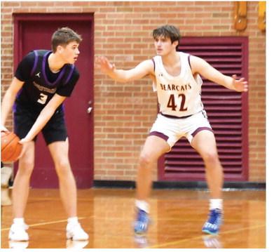 Waubay-Summit Mustangs faced off against the Webster Area Bearcats Dec. 17. Mustangs won the game 45-44. Here, Waubay-Summit guard/forward Hogan Hlavacek (3) assesses the Webster Area defense as Webster Area forward Jack Shoemaker (42) keeps applying pressure. Reporter &amp; Farmer | Brenner Cariveau