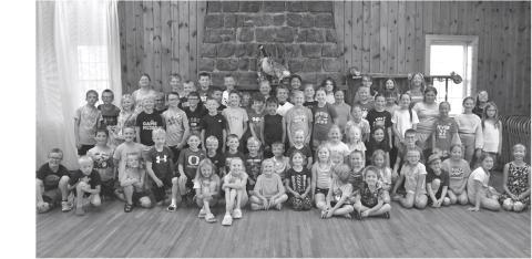 Webster Public Library’s summer reading program party attendees pose for a picture at Izaak Walton in Webster June 30. Sitting in front row from left are Harlyn Deutsch, Amelia Keintz, Aubree Kwasniewski, Huntley Aadland, Berkley Matthews, Jadyn Campbell, Laynie Bjerke, Isaiah Campbell, Arabella Ewing, Beatrix Howe, Leo Siemonsma, Harlow Heupel, Leah Waldner and Ally Moos. Kneeling from left are Rhett Kuecker, Kohenn Konradi, Tyler Acree, Morgan Snaza, River Marko, Audie Kuecker, Harrison Fosheim, Nixon Deu