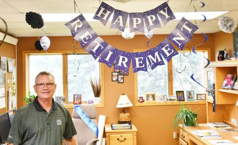 Lake Region Electric manager Tim McIntyre stands next to his decorated office which celebrates his upcoming retirement Sept. 3. Reporter &amp; Farmer | Brenner Cariveau