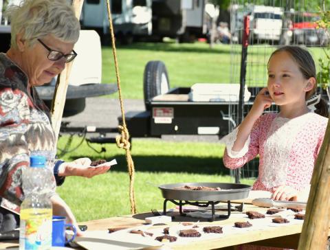 Reenactors Kendall Johnson and Jill Johnson prepare brownies for patrons at Fort Sisseton Historical Festival June 1 at Fort Sisseton State Park. Reporter &amp; Farmer | Luke Caputo