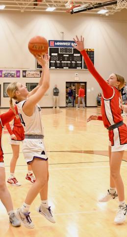 Waubay/Summit Mustangs girls basketball team played host to the Estelline/Hendricks Redhawks Feb. 11 in Summit. Here, player 14 Kayce Berger goes up for a basket. The Mustangs galloped away with the win over the Redhawks, going 13-7, 28-16, 28-41 and 55-41 in the final. Stats of the game were not provided to this publication by deadline. Reporter &amp; Farmer | Robert Dulitz