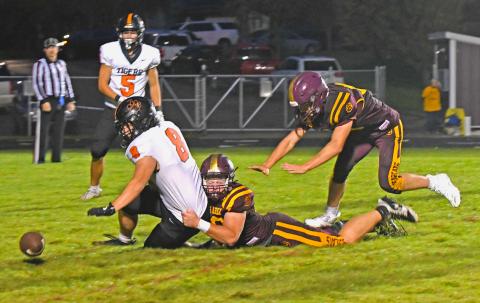 Matthew Mount (52) of Webster Area forces a fumble as he brings down Mobridge-Pollock Tigers running back Tyler Schmeichel (8) during the Bearcat’s 0-50 loss Sept. 19 in Webster. Statistics for the game were not provided in time for publishing. Reporter &amp; Farmer | Amanda Dulitz
