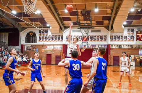 Seth Lesnar of Webster Area floats a shot over Redfield Pheasant defenders during the Bearcats 85-64 Region 1A playoff victory March 3 in Webster. The win was the Bearcats first regional playoff victory in 22 years spanning back to 2004. Reporter &amp; Farmer | Connor Handrahan