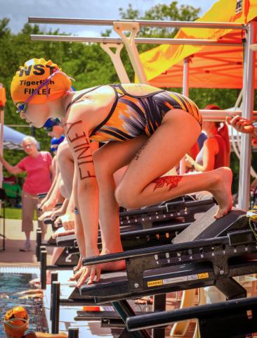 Finley Marko, age nine, of Webster Swim Team prepares to start the 50 yard freestyle event during the Webster Seasonal State Meet at the Webster Aquatic Center July 25. Marko placed 14th with a time of 55.67 seconds. Reporter &amp; Farmer | Leyton Beardslee