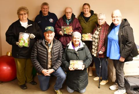 Christmas cookies were donated to local veterans Dec. 18. Pictured from back left, Jill Gaikowski, Doug VanHoudt, Wayne Klungseth, Jenna Wik, Gail Torrence and Winnie Jacobs; in front from left Kevin Bohn and Mary Bloom. Reporter &amp; Farmer | Brenner Cariveau