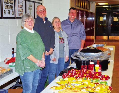 Roslyn Booster Club provided sandwiches, chips and cookies to the community for their appreciation day and Santa meet and greet Dec. 5. From left, Mary Wagner, Ryan Wagner, Shelly Deutsch and Josh Wagner greeted and served guests as they entered the community center. Reporter &amp; Farmer | Connor Handrahan