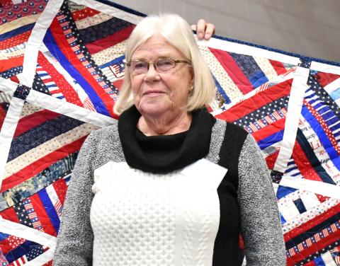 Reporter &amp; Farmer | Leyton Beardslee Winnie Jacobs receives a Quilt of Valor for her late husband William Jacobs during the annual veterans banquet at Webster Armory Nov. 8. William Jacobs served as a Petty Officer in the United States Navy from 197074 and his awards include Combat Action Ribbon, Vietnam Campaign Medal, and the Vietnam Service Medal with Bronze Star.