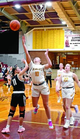 Webster Area Bearcats girls basketball hosted the Waverly/South Shore Coyotes Jan. 27. Bearcats won with a final score of 61-43. Here, Harley Johnson (10) attempts a layup as her teammates Bailee Ninke (22) and Erin Sannes (34) follow close behind while Waverly/South Shore’s Dashaya Koch (11) attempts to block the shot. Reporter &amp; Farmer | Robert Dulitz