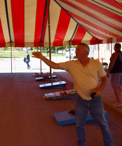 The annual Germanfest was celebrated Sept. 28. One of the many activities during the day was a cornhole tournament which cost $40 per team to register. Here, Rick Guse from Bartonville attempts a tune up shot prior to the tournament’s starting time. Reporter &amp; Farmer | Brenner Cariveau