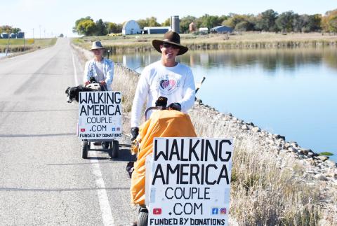 Torin and Paige Rouse walk with their dog Jak in their 12,000 mile journey which would result in them walking across every state. Here, the Rouse family walks just outside of Webster Oct. 7 as they prepared to finish up their trip in Watertown. Reporter &amp; Farmer | Brenner Cariveau