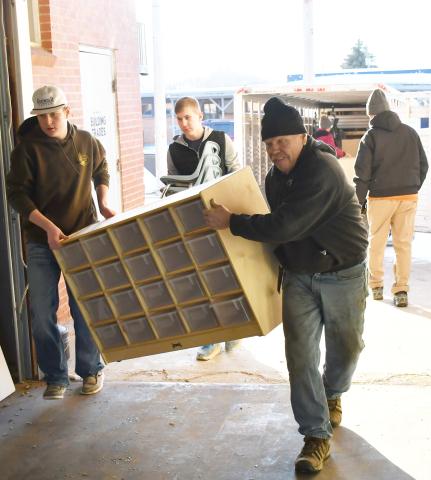 In order to renovate the Knapp &amp; Play Learning Center building for a Webster day care, old furniture was being transported to the Lake Region Business Center Feb. 21 for storage. Here from left, Caleb Gaikowski, Gabriel Gaikowski and Nathan Meland haul a large organizer into a storage area. Reporter &amp; Farmer | Brenner Cariveau
