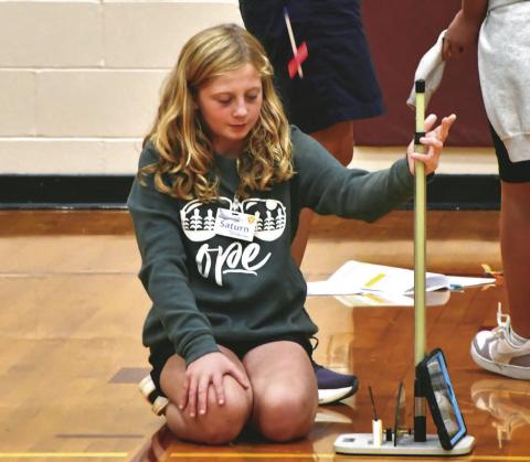 Reporter &amp; Farmer | Leyton Beardslee Webster Area fifth grader Tenlee Wik, daughter of Matt and Jenna Wik, launches an air pressure powered rocket made from a straw Sept. 9. in the Webster Area High School gym. The experiment was part of the weeklong STARBASE program hosted by the school which teaches students about STEM concepts.