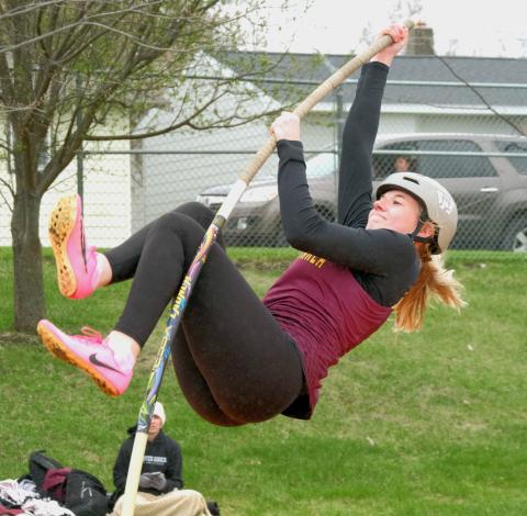 Webster Area High School junior Madison Block eyes the bar during a pole vault attempt at a meet in Webster April 28. Reporter &amp; Farmer | Leyton Beardslee