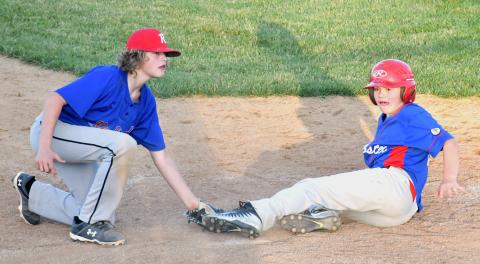 Webster VFW Post 4690 Karstyn Schlechter, right, slides into home June 26 during a home game against the Redfield Flickertails. Reporter &amp; Farmer | Luke Caputo