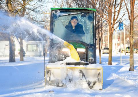 Brian Holland blows snow off a sidewalk outside Day County Courthouse March 18 in Webster. Reporter &amp; Farmer | Leyton Beardslee