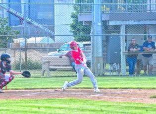 Bennett Kuecker hits a single during Webster Teeners’ first game against Lake Norden June 5. Kuecker was one of 11 runs to be scored in the first inning, which eventually led to a 16-6 victory. Reporter &amp; Farmer | Connor Handrahan