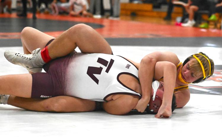 Gage Baumgarn of Webster Area gets his opponent in a hold during the Ken Ruml Tournament in Howard Dec. 13. Baumgarn finished fourth in the 165 weight class with a record of 3-2. Reporter &amp; Farmer | Brianna Jorgenson, Captured Creations Photography