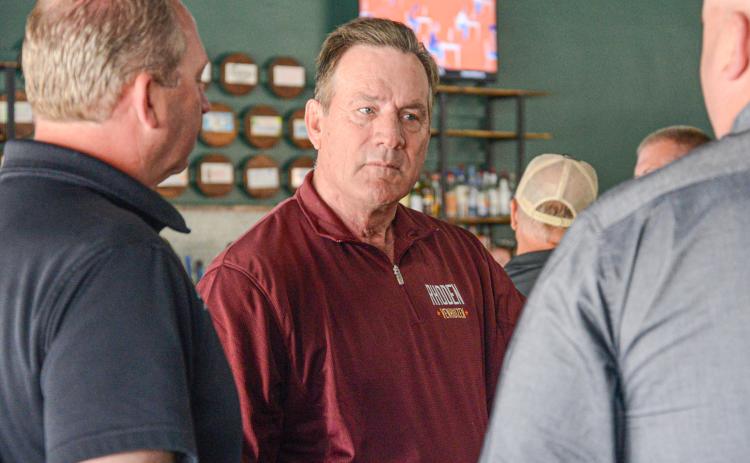 South Dakota sitting governor Larry Rhoden was at a meet and greet event in Webster May 28 ahead of the June 2 primary election. Shown here, he visits with Brett Kwasniewski and Jeremy Lindemann of Lake Region Electric. Reporter &amp; Farmer | Amanda Dulitz