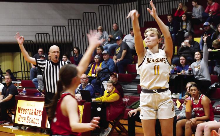 Webster Area girls basketball hosted Britton-Hecla Dec. 20 at the Webster Armory. Bearcats won the contest 50-29. Here, Webster Area guard Lydia Vogl (11) shoots a three pointer while Britton-Hecla defender Heather Storbakken (3) closes out to the three point line. Reporter &amp; Farmer | Brenner Cariveau